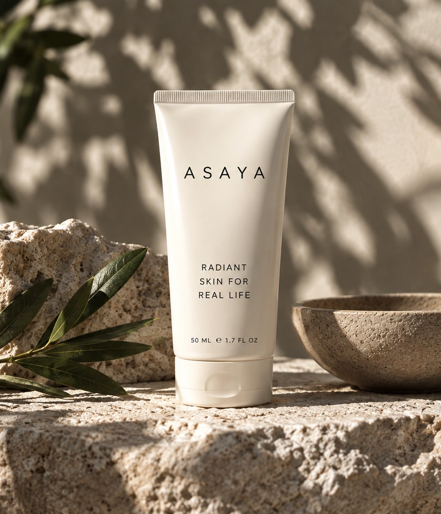 Skincare tube photographed in warm natural light on stone